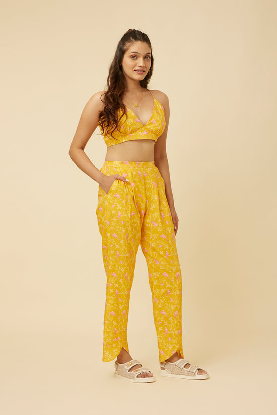 Rear view of the Peela Sunshine Pants displaying the comfortable back elastic design and the playful hemline, perfect for a stylish and comfortable look