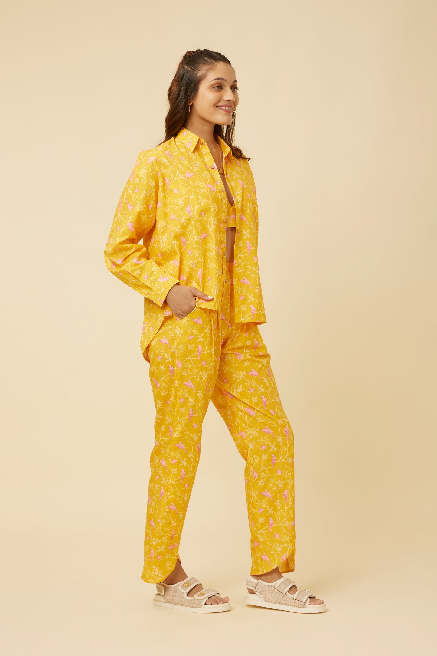 Side view of the relaxed-fit Peela Sunshine Full-Sleeve Shirt worn with coordinated pants, showing the option to wear the shirt tucked in or out