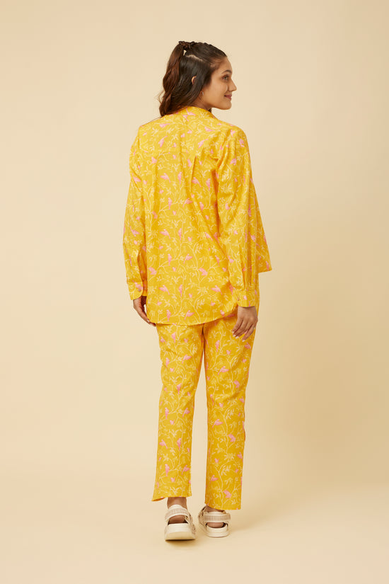 Back view of the Peela Sunshine Full-Sleeve Shirt showing the relaxed fit and full sleeves, paired with matching pants for a complete cheerful look