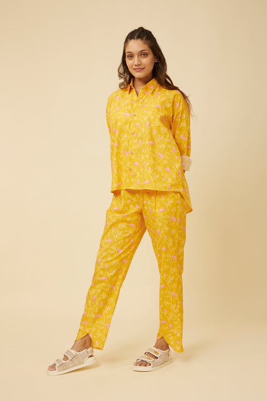 Three-quarter view of a model in the Peela Sunshine Full-Sleeve Shirt and pants, illustrating the shirt’s versatility and relaxed, cheerful style