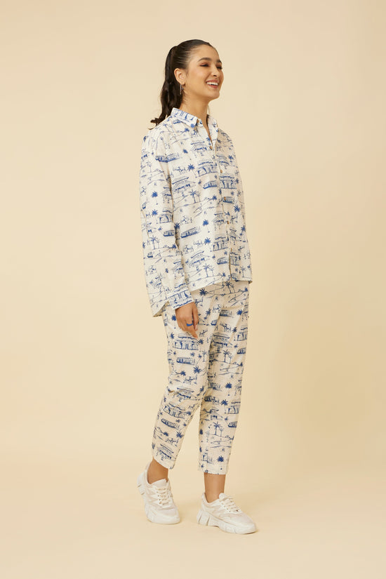 Side view of model in Homeland Pants displaying the relaxed fit and seamless coordination with the matching print shirt for a contemporary look