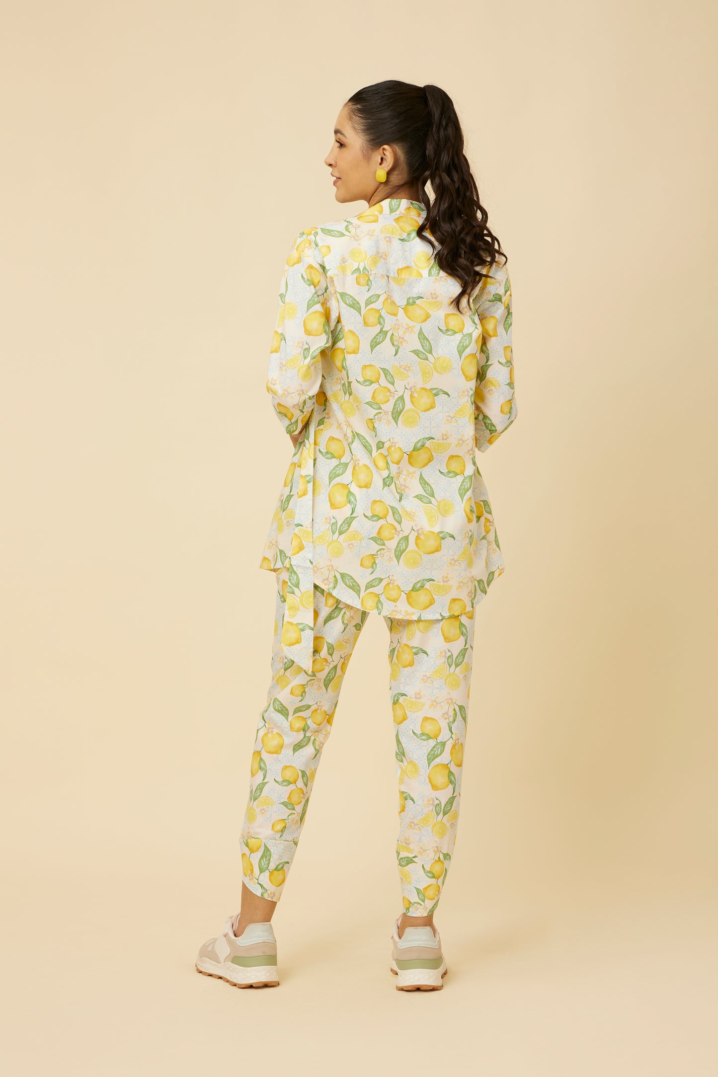 Rear view of the Citrus Dream Full-Sleeve Shirt highlighting the flowing design and side-tie feature, with the lemon tile print maintaining its charm from all angles, embodying a balance of comfort and fresh fashion.