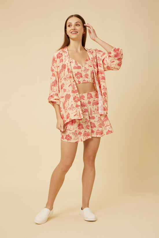 Model in a three-quarter stance wearing the 'Jaipur Rani' co-ord set, combining the casual elegance of the printed shirt with the functionality of the shorts