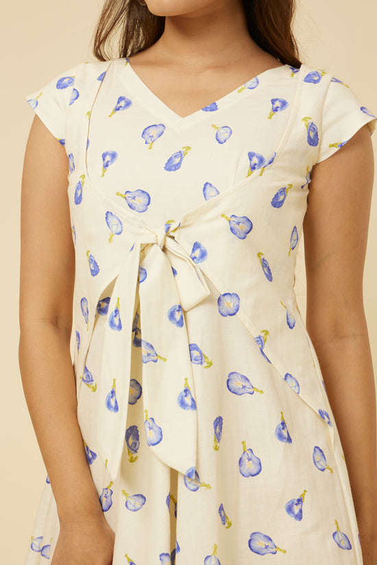 Close-up of the Blue Pea Dress's V-neck design with converging side flaps and front ties against a white base with vibrant blue pea floral print, a testament to Hypsway’s attention to detail and stylish craftsmanship.